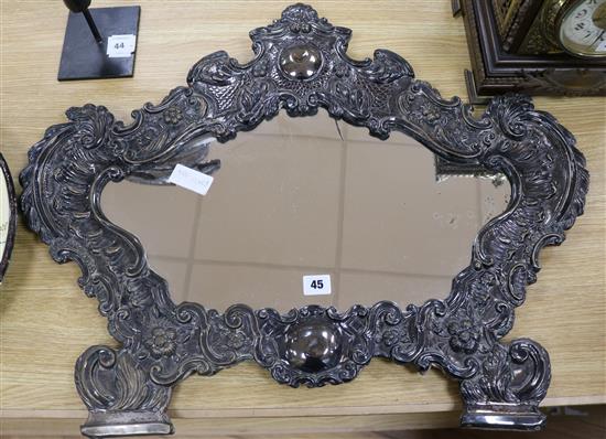 A late 19th century Italian plated and embossed cartouche shaped wall mirror length 72cm
